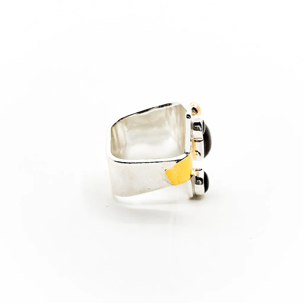 Sterling, 24k, and 14k Crotch Hugger Ring with Garnet